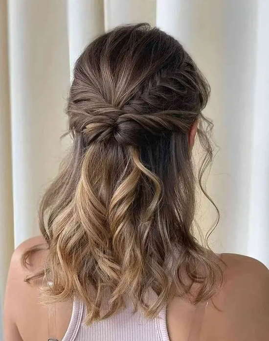 An eye catching boho half updo with a twisted and braided halo, waves down is a stylish idea for medium length hair