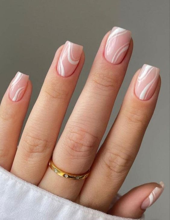 delicate blush and white swirl nails are a creative take on French ones, they look lovely