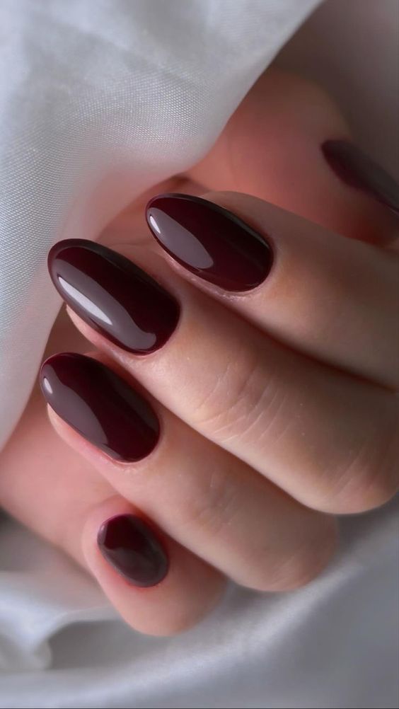 glossy oval burgundy nails are a chic and stylish solution if you want some color
