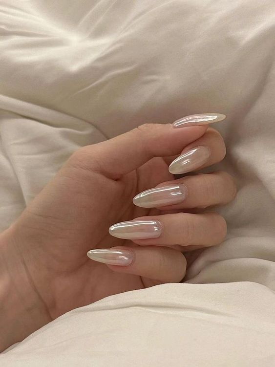Long almond shaped pearly nails are a perfect way to look chic, stylish and refined at the same time