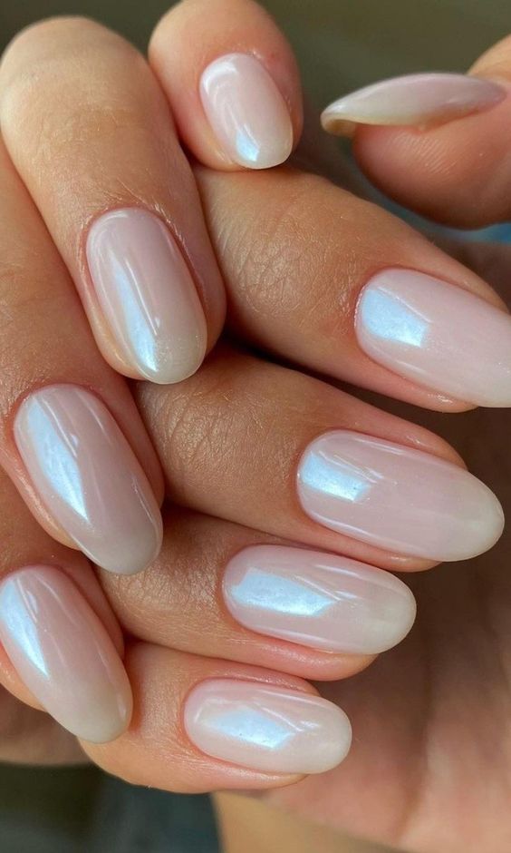 shiny metallic nude nails of an oval shape are a chic and stylish idea for a spring or summer look