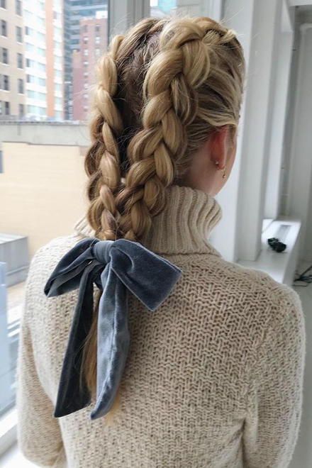 two braids on top and a dusty blue velvet bow for an accent are a cool combo to rock
