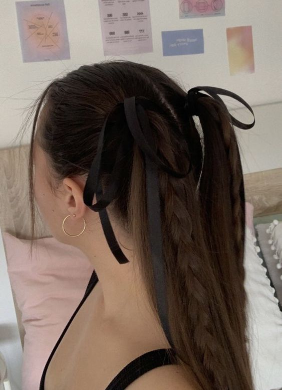 two high ponytails with braids and a sleek top plus two black bows are a lovely idea to look girlish and cool