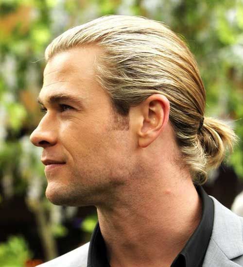a blonde man bob styled with a low ponytail, a sleek bump on top is very comfortable in wearing