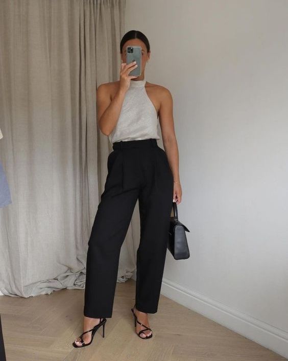 a bold and chic look with a grey halter neck top, black pants, black strappy heels and a black bag can be worn to graduation and to work in summer
