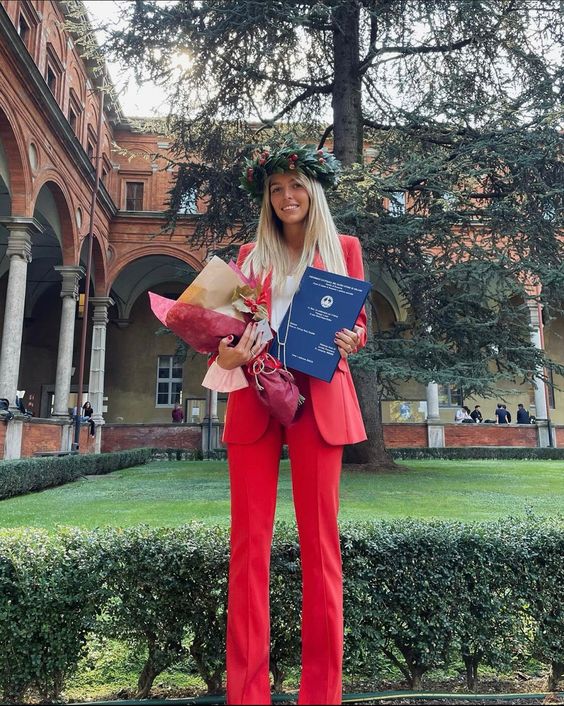a bold red pantsuit with an oversized blazer and a white top are a timeless combo for any graduation, and this stylish suit can be worn afterwards