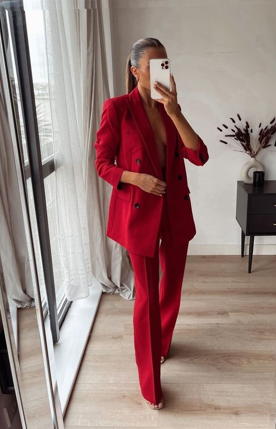 a bold red pantsuit with an oversized blazer and shoes are a cool look for graduation and you will be able to wear it to work afterwards