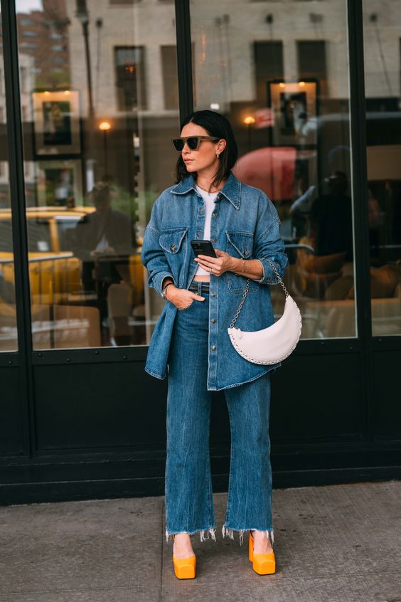 a bold spring look with a white top, a blue denim shirt, blue jeans, orange shoes and a white baguette bag