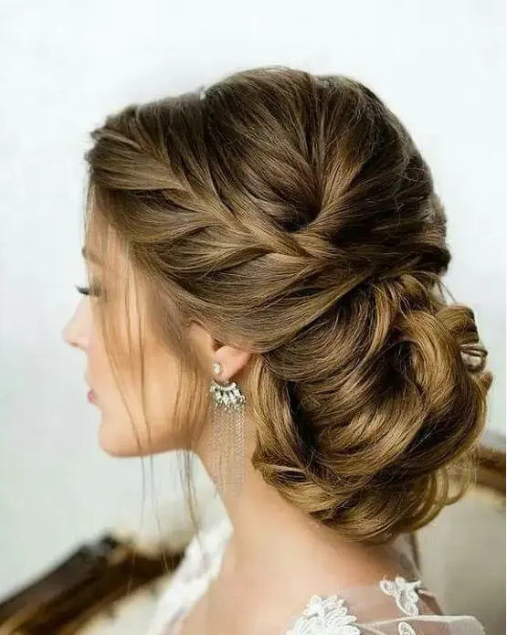 a braided low side updo looks gorgeous and fits a lot of wedding styles, it’s perfect for long hair