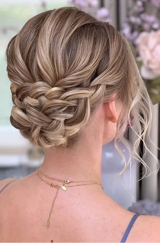 a braided updo with a volume on top and waves down is a lovely boho or just romantic hairstyle