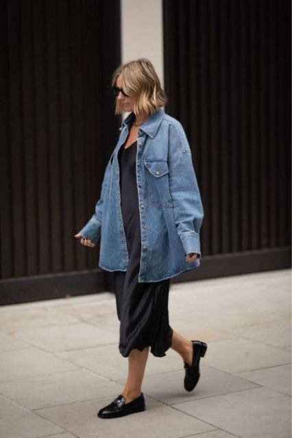 a casual outfit with a black slip midi dress, a blue oversized denim shirt, black loafers is a lovely everyday look