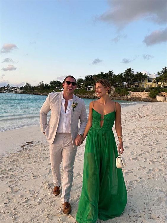 A chic green A line dress with a draped bodice and spaghetti straps is all you need to look gorgeous at a beach wedding