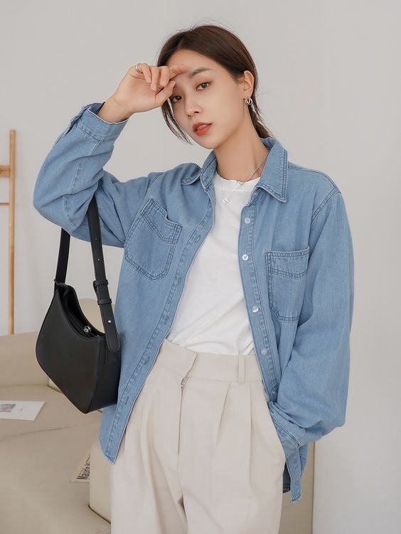 A classy spring look with a white t shirt, tan pants, a blue denim shirt, a black bag is very comfortable