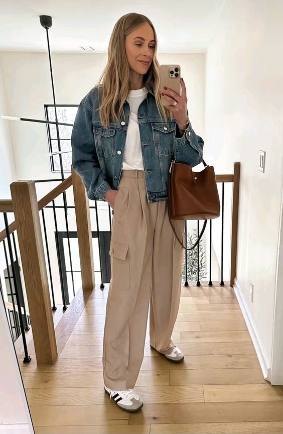 a comfy spring look with a white t-shirt, a blue denim cropped jeans, tan cargo pants, neutral sneakers, a brown bag