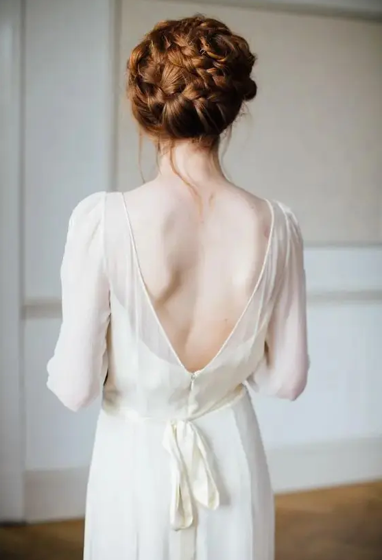 a completely braided updo on long ginger hair, with a bit of locks down is great for a boho bride