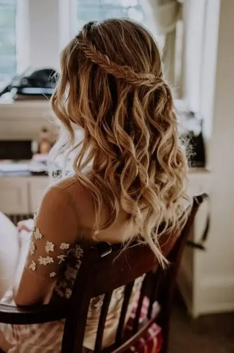 a cool wedding hairstyle with a fishtail braid