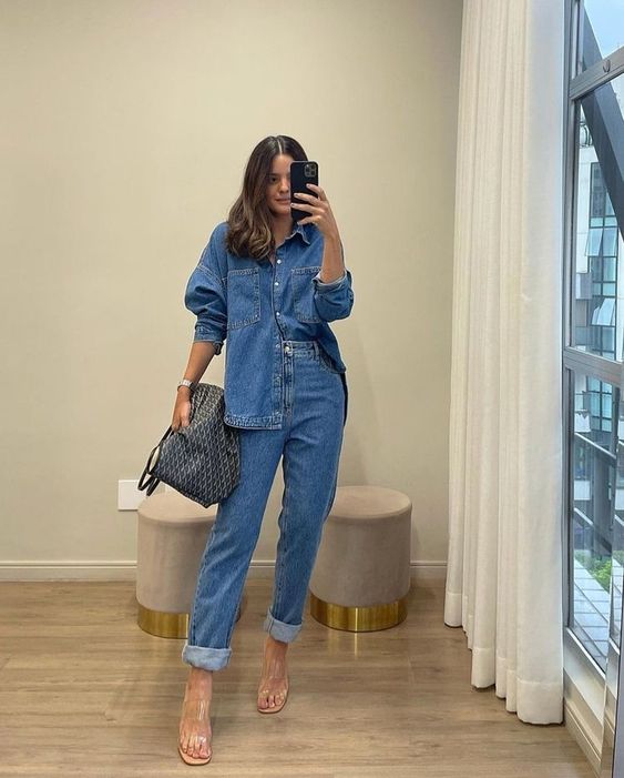 a double denim look with a shirt, cuffed jeans, clear shoes and a printed bag is super cool