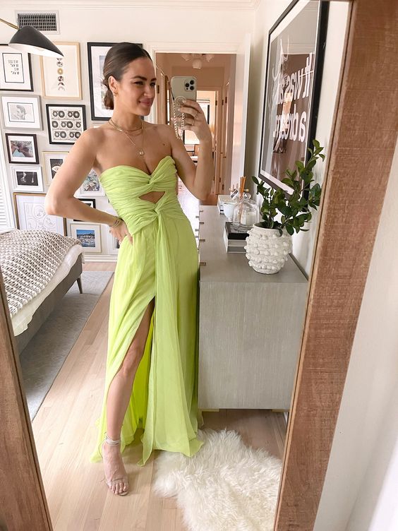 a gorgeous neon green strapless maxi dress with draperies and a thigh high slit plus nude shoes is a cool idea for a beach or tropical wedding