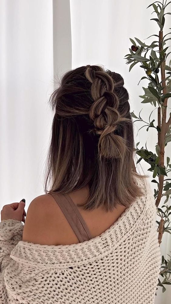 a lovely half updo with a loose braid on top and some hair down is a cool and romantic casual hairstyle