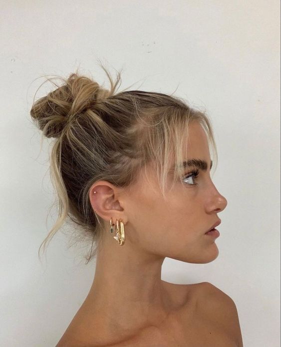a messy top knot with a sleek top is a cool idea for every day, it looks cute and is comfy in wearing