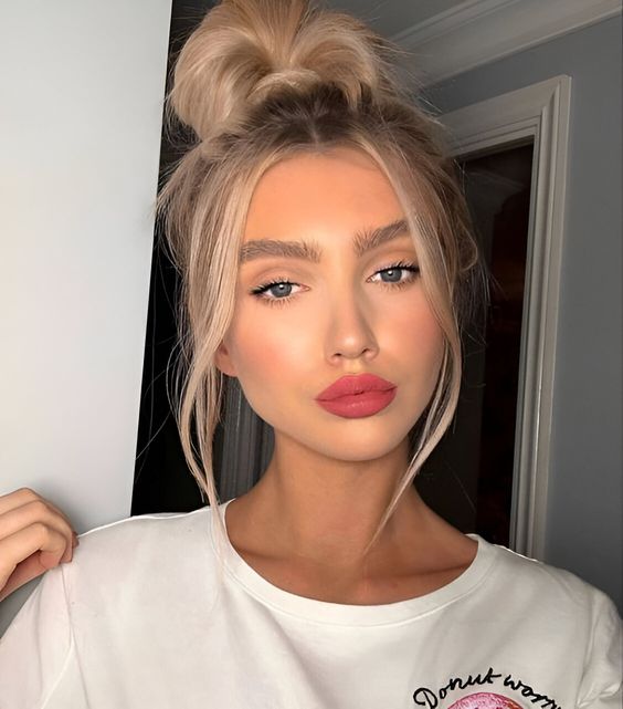 A messy top knot with face framing hair and messy top is always a good idea for every day