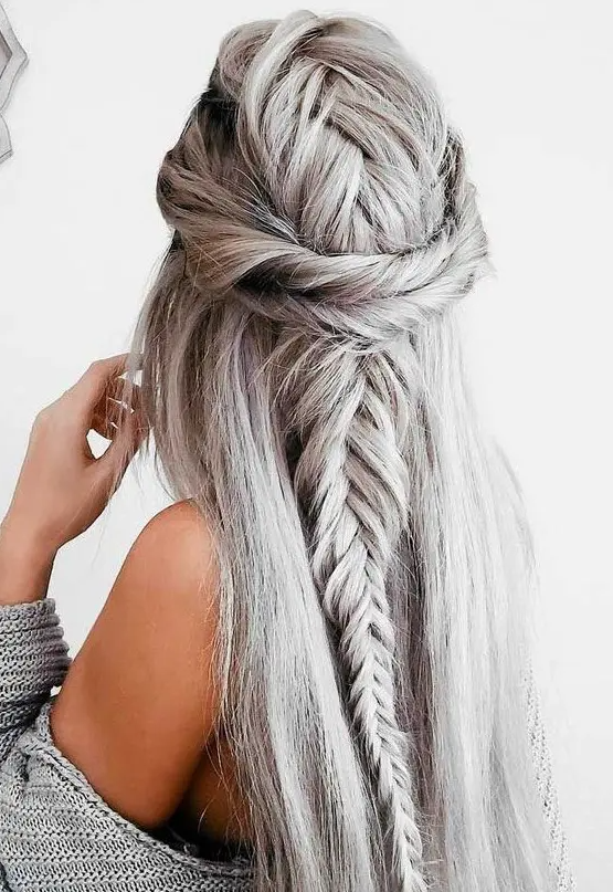 a quirky silver half updo with a voluminous braided top, twists and a fishtail braid down plus straight hair down