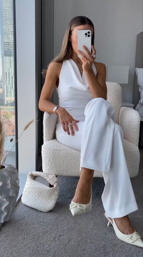 a refined white look with a cowl neck top and pants, ivory slingbacks and a bag are a cool and chic combo for graduation