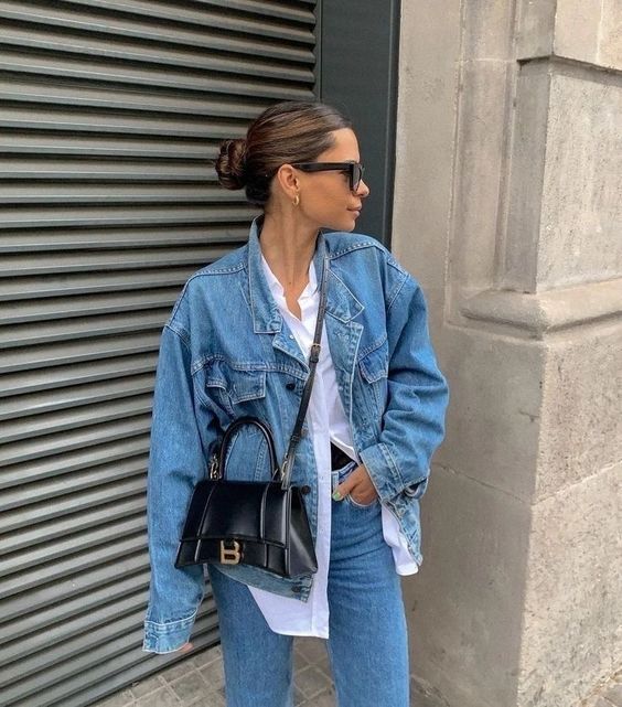 a simple and chic spring look with a white button down, a blue denim jacket and jeans, a black bag