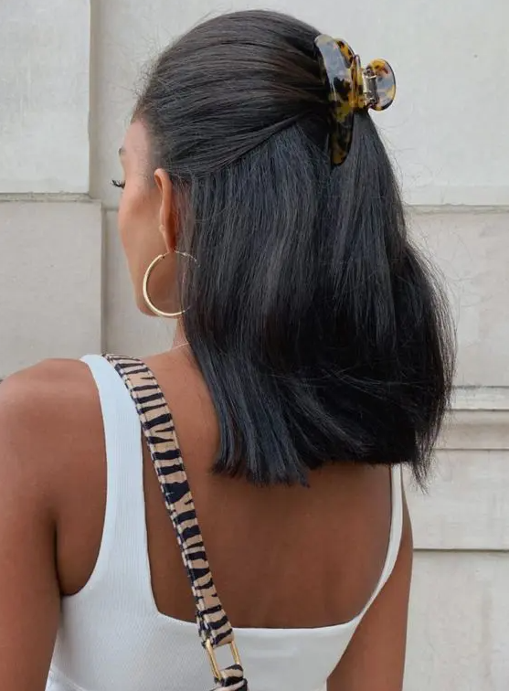 a simple half updo you can make on the securing your hair easily is a cool idea for every day