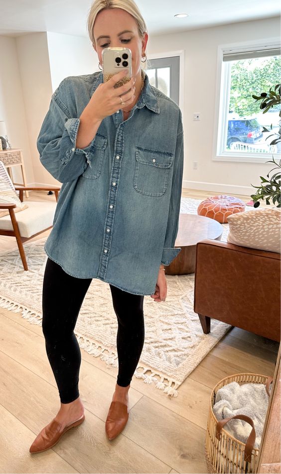 a simple spring outfit with a blue denim shirt, black leggings, brown slipper mules is quick and comfy