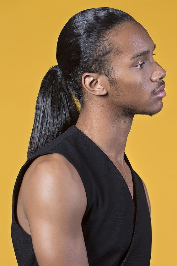 a sleek and shiny long low ponytail with a lot of volume is a bold way to show off your shiny locks