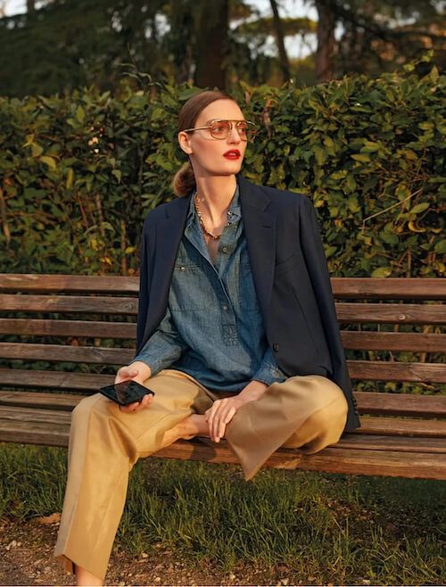 a spring or fall look with a blue chambray shirt, a navy blazer, beige leather pants and some chic accessories