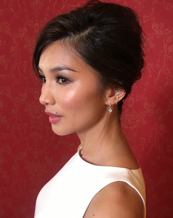 a timeless and elegant updo with side parting and side bangs is a cool and retro-inspired hairstyle for a wedding