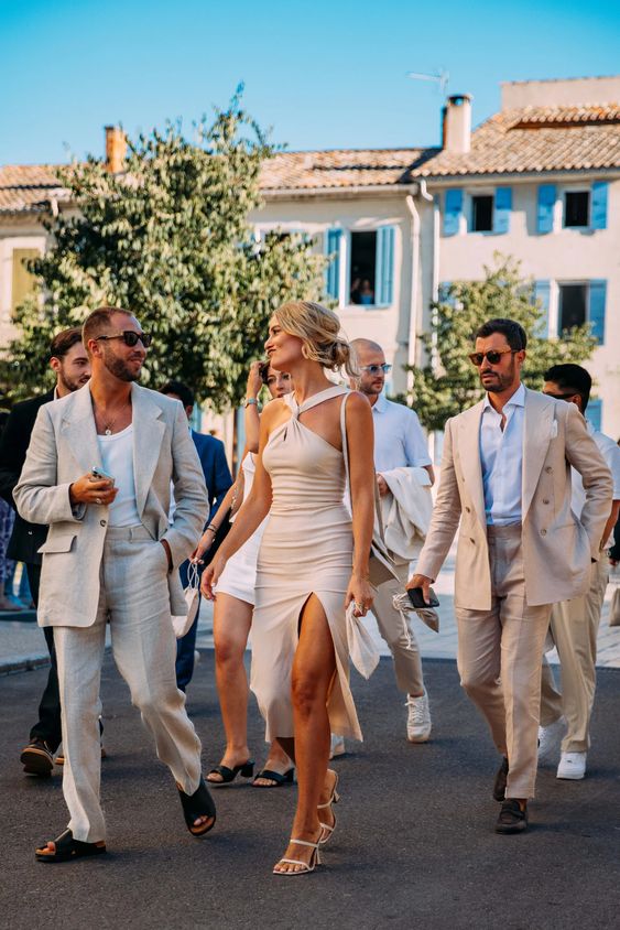 neutral linen pantsuits with some tops and shoes are always a great idea for a beach wedding