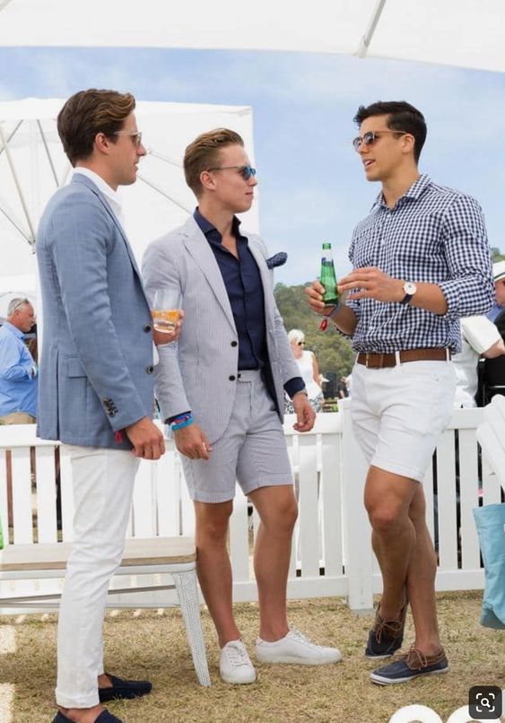 white pants, a button down, a blue blazer, a blue suit with shorts and a navy button down, white shorts and a printed button down