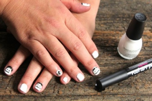 a simple black and white zombie Halloween nail art is a stylish and contrasting idea for this cool party
