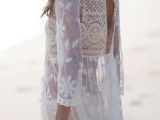 a white semi sheer lace mini dress with a cutout back is a trendy piece for a boho girl