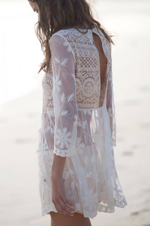 a white semi sheer lace mini dress with a cutout back is a trendy piece for a boho girl