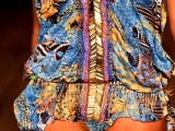 a super colorful and printed mini dress with a deep plunging neckline is a nice pair for a bright printed swimsuit