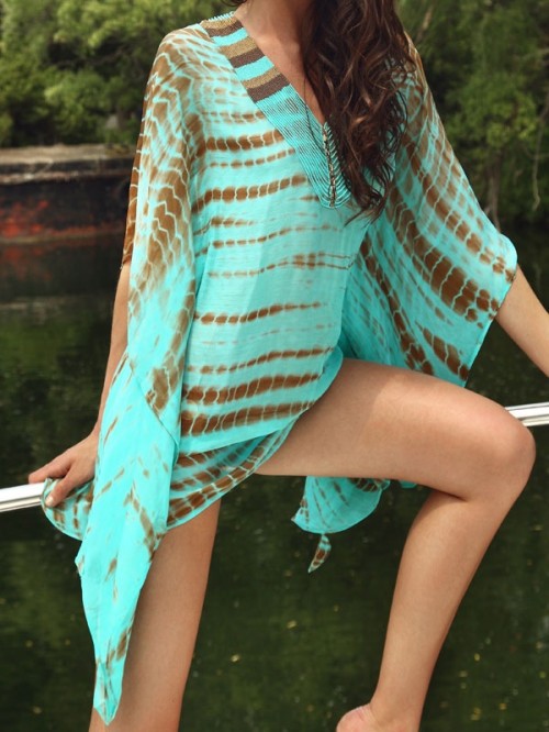 a turquoise and brown beach mini dress with long wide sleeves and a high neckline is very comfy