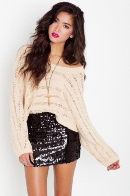 a neutral one shoulder sweater, a black sequin mini skirt and a statement necklace are a lovely combo for a NYE party