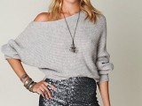 a silver one shoulder sweater, a black sequin mini skirt, a statement necklace are a lovely combo for a NYE party