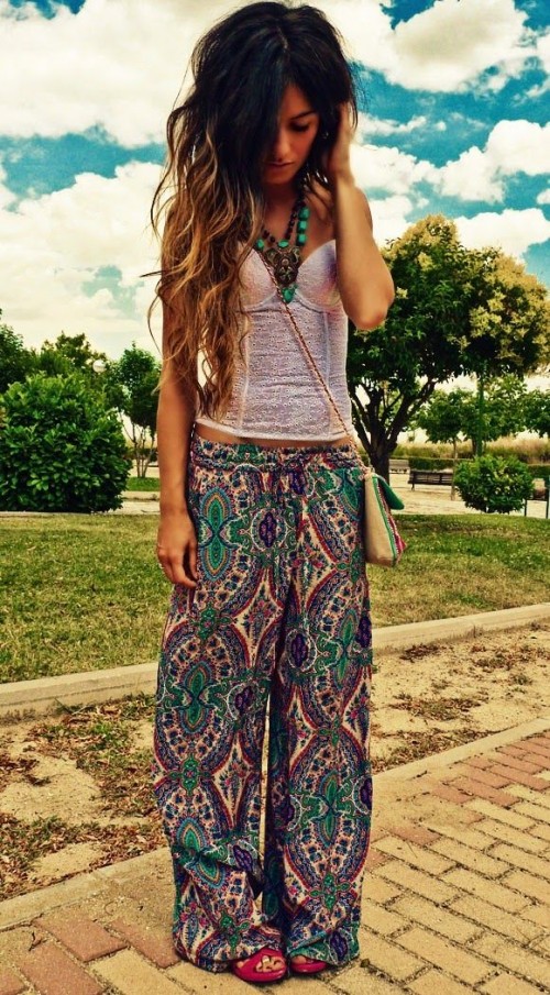 a bright boho look with a white lace top, colorful pants, layered necklaces and a neutral crossbody bag