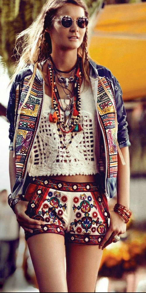 a crazy gypsy and folksy look with a lace crop top, colorful embroidered shorts and a jacket plus layered accessories all over