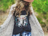 a printed t-shirt, tie dye shorts, a crochet cardigan, a hat and necklaces for a boho feel