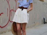 a blue striped shirt, a creamy A-line skirt, red flats, a brown belt and bag and a wide brimmed hat