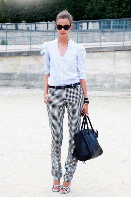 a blue shirt with puff sleeves, grey pants, plaid shoes and a black tote for a spring or summer work look