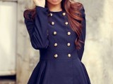 a navy A-line mini dress with gold buttons is a refined retro piece to wear anytime