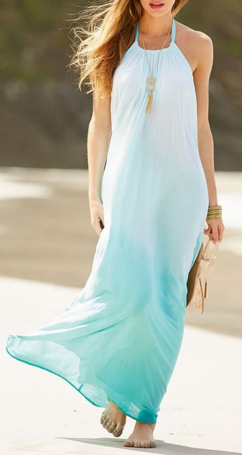 an ombre aqua-colored halter neckline beach maxi dress and a statement boho necklace for going to the beach