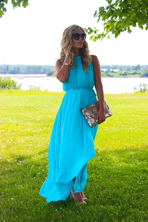 a turquoise halter neckline maxi dress, nude heels and shiny clutch for a special occasion